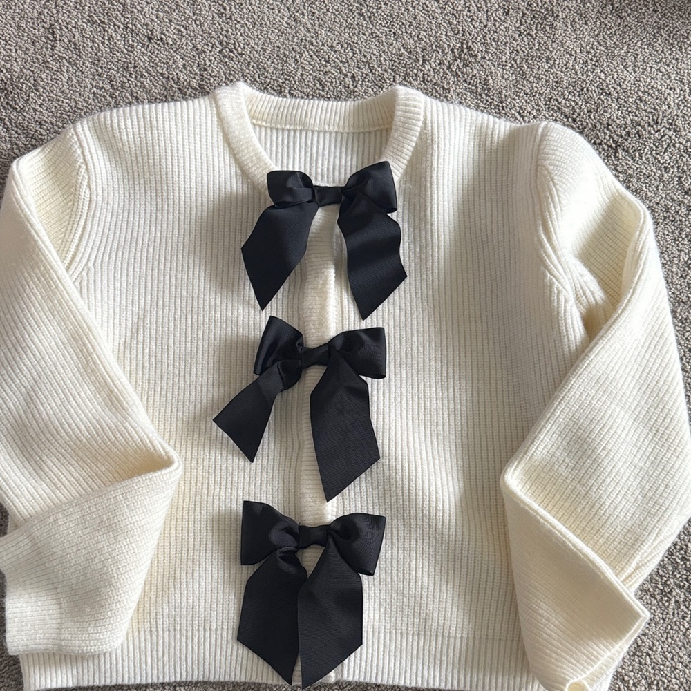 Cream Sweater with Black Bows